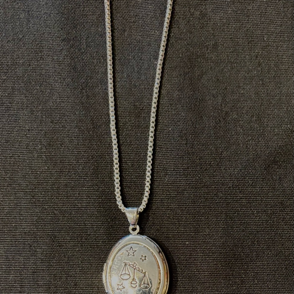 Libra charm locket on a necklace